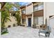Charming two-story townhome with a beautiful brick patio surrounded by tropical landscaping at 1881 N Hercules Ave # 602, Clearwater, FL 33765