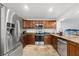 Updated kitchen featuring stainless steel appliances, granite countertops, tile flooring, and ample cabinet space at 1881 N Hercules Ave # 602, Clearwater, FL 33765