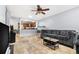 Comfortable living room featuring an open layout, travertine flooring and access to the kitchen at 1881 N Hercules Ave # 602, Clearwater, FL 33765