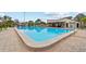 Community pool with clear blue water and ample space for relaxation and recreation at 1881 N Hercules Ave # 602, Clearwater, FL 33765