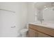 Well-lit bathroom featuring a modern vanity, mirror, and toilet for a clean aesthetic at 303 15Th N St, St Petersburg, FL 33705