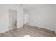 Bright bedroom with hardwood flooring, neutral walls, and ensuite bathroom at 303 15Th N St, St Petersburg, FL 33705
