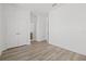 Spacious bedroom features hard wood floors, neutral paint, and closet at 303 15Th N St, St Petersburg, FL 33705