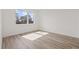Bright bedroom with large window and light wood floors at 303 15Th N St, St Petersburg, FL 33705