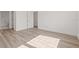 Unfurnished bedroom with light wood floors, white walls, and ensuite bathroom at 303 15Th N St, St Petersburg, FL 33705