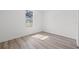 Clean bedroom space with hardwood floors and a window providing natural light at 303 15Th N St, St Petersburg, FL 33705