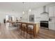 Modern kitchen with stainless steel appliances, island with seating, and an adjacent dining area at 303 15Th N St, St Petersburg, FL 33705