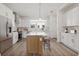 Modern kitchen featuring stainless steel appliances, white cabinetry, and a center island with seating at 303 15Th N St, St Petersburg, FL 33705
