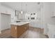 Stylish kitchen with white cabinets, stainless steel appliances, and a large center island at 303 15Th N St, St Petersburg, FL 33705