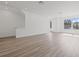 Open-concept living room with lots of light and luxury vinyl plank flooring at 303 15Th N St, St Petersburg, FL 33705