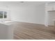 Spacious, bright living room with hardwood floors and plenty of natural light from a large window at 303 15Th N St, St Petersburg, FL 33705