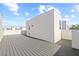 Roof top deck with wooden flooring and white perimeter walls at 303 15Th N St, St Petersburg, FL 33705