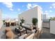 Inviting roof deck featuring outdoor seating, dining area, and grill, perfect for entertaining with a view at 303 15Th N St, St Petersburg, FL 33705