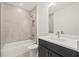 Modern bathroom with tile, a tub, and a vanity offers a clean and functional space at 321 15Th N St, St Petersburg, FL 33705