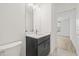 Modern bathroom with a vanity, large mirror, and sleek fixtures exudes minimalist elegance at 321 15Th N St, St Petersburg, FL 33705