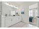 Modern bathroom showcasing a double vanity, elegant fixtures, and artwork for a touch of sophistication at 321 15Th N St, St Petersburg, FL 33705