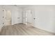 Clean bedroom with hardwood floors has an open doorway and closet doors, with views of stairs at 321 15Th N St, St Petersburg, FL 33705