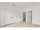 Bright room with light wood floors, double door closet, white trim and modern hardware, and an open doorway at 321 15Th N St, St Petersburg, FL 33705