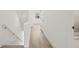 Upstairs hallway with light wood floors, white trim, white walls, and access to a shower room at 321 15Th N St, St Petersburg, FL 33705
