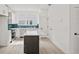Bright kitchen features white cabinets, a central island, stainless steel appliances, and neutral flooring at 321 15Th N St, St Petersburg, FL 33705
