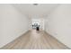 Bright living space leading into an open kitchen, with modern flooring and white walls at 321 15Th N St, St Petersburg, FL 33705