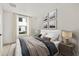 Comfortable main bedroom with a window, modern decor and lamps, a plush bed, and carpet at 321 15Th N St, St Petersburg, FL 33705