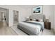 Main bedroom featuring modern furnishings, a light gray bed frame, and an ensuite bathroom for convenience at 321 15Th N St, St Petersburg, FL 33705
