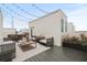 Stylish rooftop patio with modern furniture, string lights, and decorative plants for outdoor entertaining at 321 15Th N St, St Petersburg, FL 33705