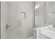 Elegant shower featuring tile, modern fixtures, glass door, built-in soap storage, and is well-lit at 321 15Th N St, St Petersburg, FL 33705