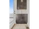 Compact wet bar featuring modern cabinetry, subway tile backsplash, and deck access at 321 15Th N St, St Petersburg, FL 33705