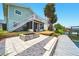 Large backyard area featuring a fire pit, dock, and multiple outdoor entertaining areas at 3312 Holly Springs Dr, Hernando Beach, FL 34607
