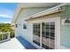 Balcony view showing sliding glass doors to the main living space at 3312 Holly Springs Dr, Hernando Beach, FL 34607