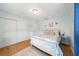 Cozy bedroom features a white bed frame, light blue walls, and a plush rug for added comfort at 3312 Holly Springs Dr, Hernando Beach, FL 34607