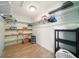 Walk-in closet with shelving and ample storage space, providing practical organization at 3312 Holly Springs Dr, Hernando Beach, FL 34607