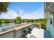 Outdoor deck with bar, seating, and a scenic view of the surrounding neighborhood at 3312 Holly Springs Dr, Hernando Beach, FL 34607