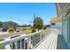 Second story deck with white railings and a neighborhood street view at 3312 Holly Springs Dr, Hernando Beach, FL 34607