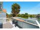 Outdoor deck overlooking a calm body of water and lush greenery, great for relaxation at 3312 Holly Springs Dr, Hernando Beach, FL 34607