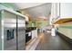 Kitchen with stainless steel appliances, white cabinetry, and dining area in the background at 3312 Holly Springs Dr, Hernando Beach, FL 34607