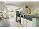 Well-equipped kitchen with modern appliances, white cabinetry, and a breakfast bar at 3312 Holly Springs Dr, Hernando Beach, FL 34607