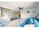 Comfortable living room with stylish decor, coffered ceiling, and a cool blue sofa with nautical accents at 3312 Holly Springs Dr, Hernando Beach, FL 34607