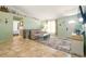 Cozy living room with tile floors, a comfortable sofa, and coastal-themed decor at 3312 Holly Springs Dr, Hernando Beach, FL 34607