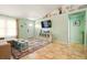 Comfortable living room with large patterned rug, tv, and coastal decor at 3312 Holly Springs Dr, Hernando Beach, FL 34607