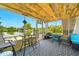 Relaxing screened patio featuring outdoor seating and views of the canal, perfect for enjoying nature at 3312 Holly Springs Dr, Hernando Beach, FL 34607