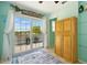 Cozy sunroom with large windows, and outdoor access, creating a welcoming space at 3312 Holly Springs Dr, Hernando Beach, FL 34607