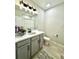 Neutral bathroom with gray vanity, white countertop, and modern fixtures at 33560 Castaway Loop, Wesley Chapel, FL 33543