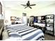 Spacious bedroom features a comfortable bed, decorative furnishings, and ample space at 33560 Castaway Loop, Wesley Chapel, FL 33543