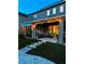 Relax on this covered patio with ambient lighting, a smooth stone walkway, and ample space for seating at 33560 Castaway Loop, Wesley Chapel, FL 33543