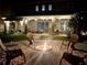 Enjoy evenings around the modern fire pit in this backyard, perfect for gatherings and relaxation at 33560 Castaway Loop, Wesley Chapel, FL 33543