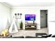 Bright living room with a tent, entertainment center, and gray carpet at 33560 Castaway Loop, Wesley Chapel, FL 33543