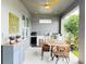 Inviting outdoor kitchen and dining area featuring a ceiling fan and stylish decor at 33560 Castaway Loop, Wesley Chapel, FL 33543
